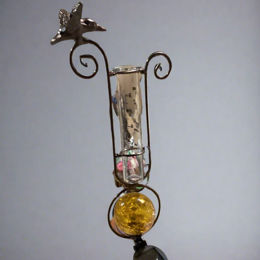 Rain Gauge with Orange Solar Ball and Bird
